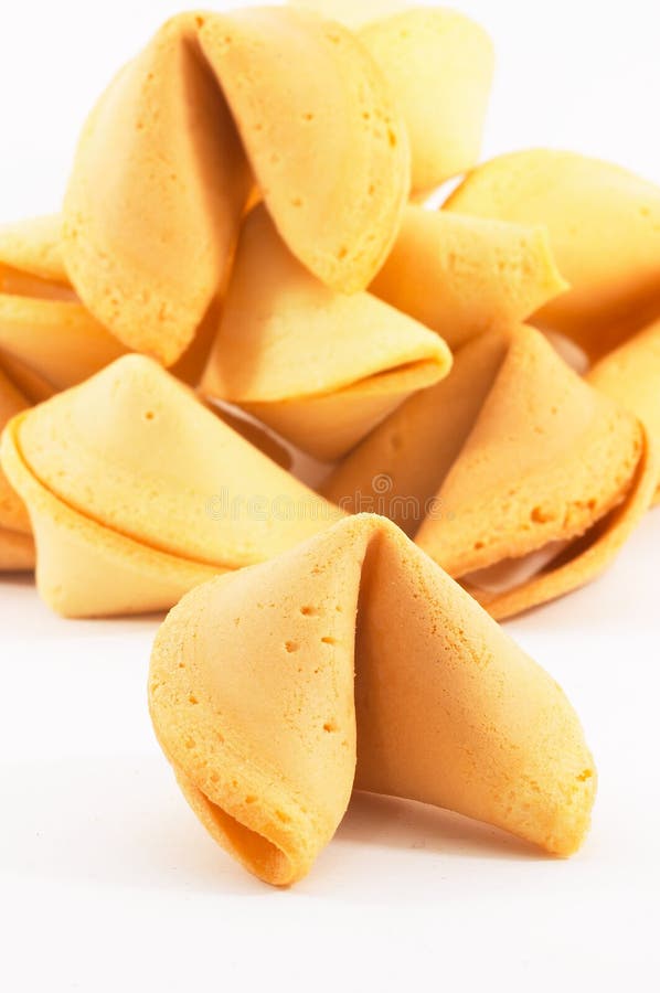 Many Chinese fortune cookie one stand out, on white background, side view. Many Chinese fortune cookie one stand out, on white background, side view