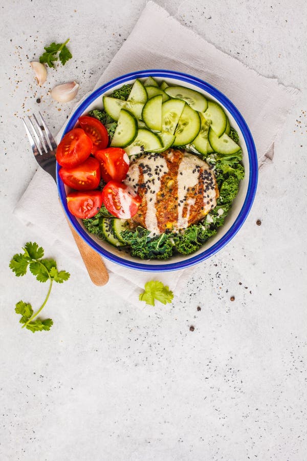 Vegan Bean Cutlet with Vegetable Salad and Tahini Dressing. Plan Stock