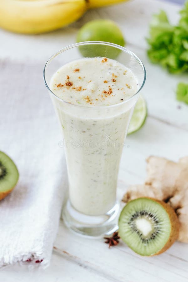 Vegan Drink Smothie Made from Fresh Ginger and Fruits. Stock Photo