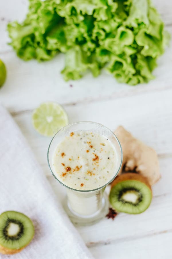 Vegan Drink Smothie Made from Fresh Ginger and Fruits. Stock Photo