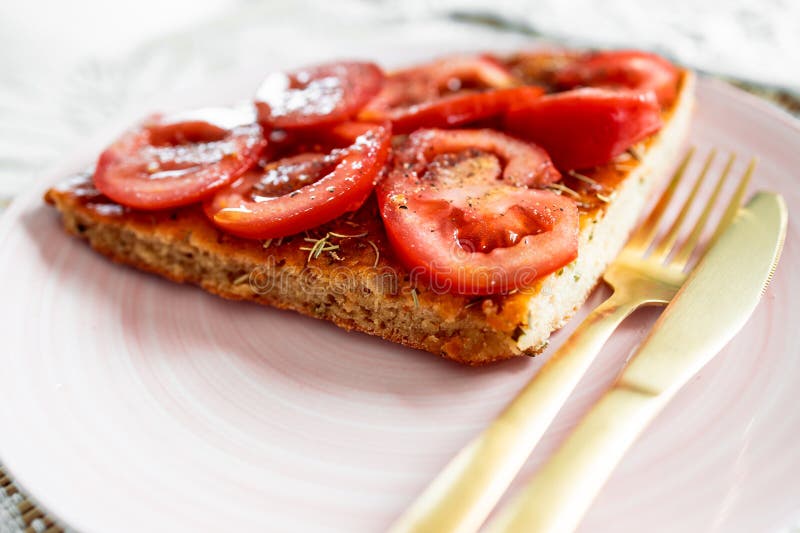 Vegan homemade focaccia topped with fresh tomato. Homemade focaccia topped with fresh tomato, healthy vegan food recipes stock image Vegan homemade focaccia topped with fresh tomato. Homemade focaccia topped with fresh tomato, healthy vegan food recipes stock image