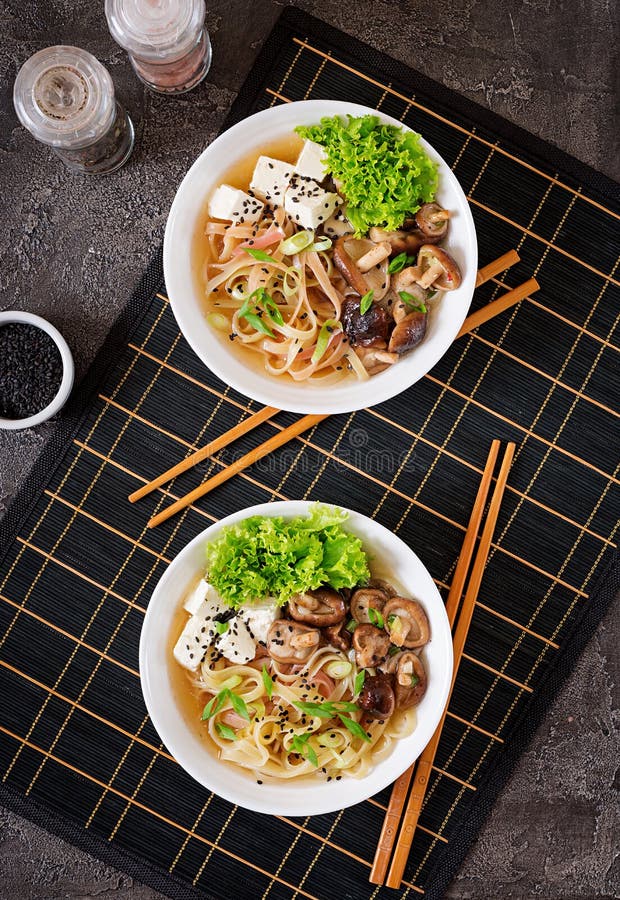 Vegan Noodle Soup with Tofu Cheese, Shiitake Mushrooms Stock Photo