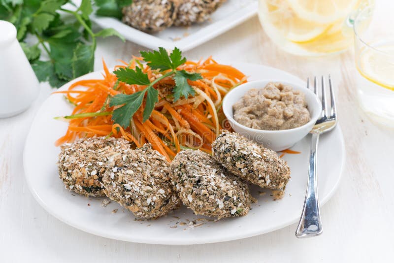 Vegans lunch - burgers bean and carrot salad on a plate