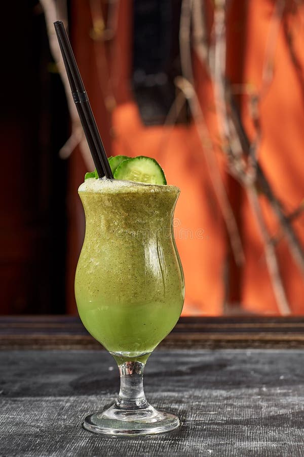 Vegetable cocktail. Cucumber smoothie close up.Natural morning light. Vegetable cocktail. Cucumber smoothie close up. Benefit drinking. Nutrition for health stock photo Vegetable cocktail. Cucumber smoothie close up.Natural morning light. Vegetable cocktail. Cucumber smoothie close up. Benefit drinking. Nutrition for health stock photo