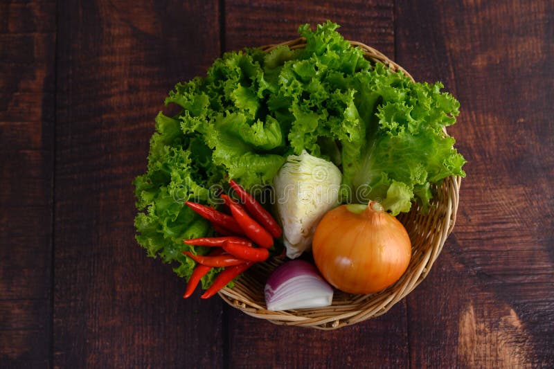 Vegetable and Ingredient Herb for Cooking Salad in Wicker Basket Stock
