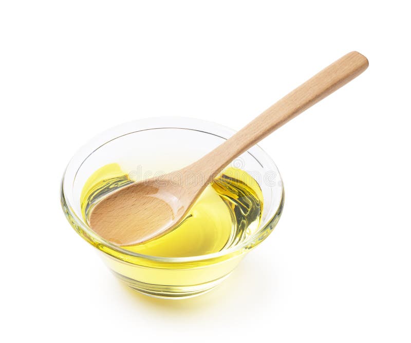 Vegetable Oil and Wooden Spoon on a White Background Stock Photo