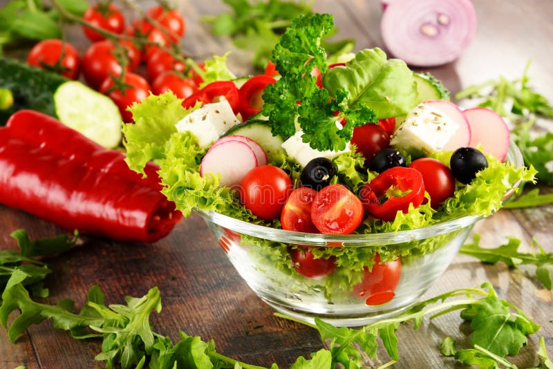 Vegetable Salad Bowl on Kitchen Table. Balanced Diet Stock Photo