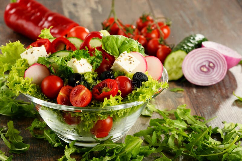 Vegetable Salad Bowl on Kitchen Table. Balanced Diet Stock Photo