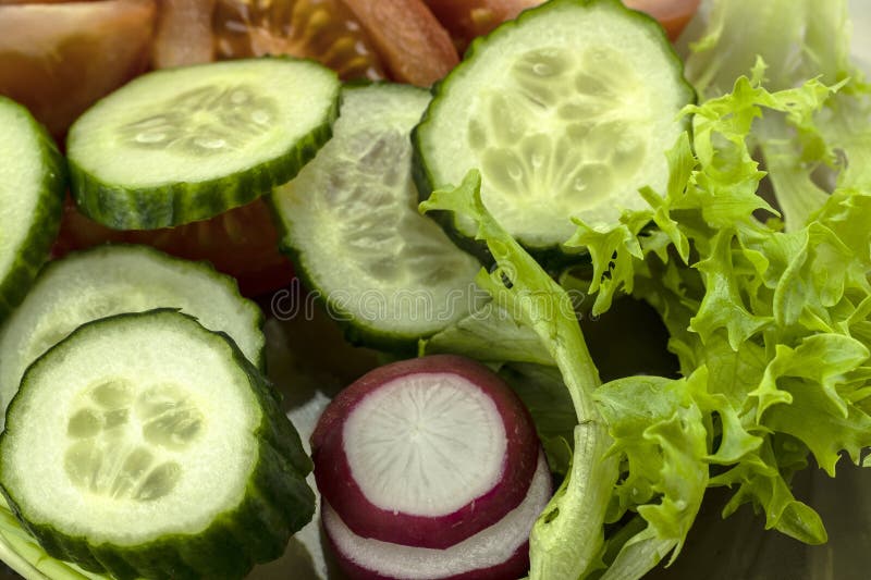 Vegetable Salad with Fresh Vegetables and Lettuce. Closeup Stock Photo