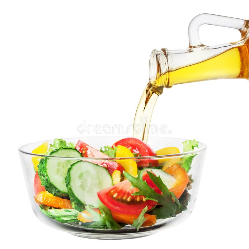 Vegetable Salad with Oil Pouring from a Bottle on White Stock Image