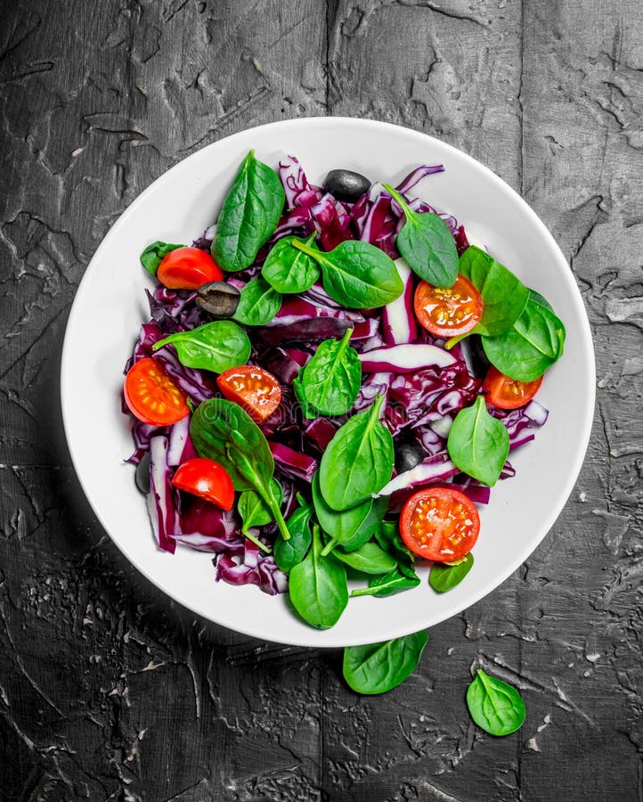 Vegetable Salad. Red Cabbage, Tomato and Spinach Salad with Olive Oil