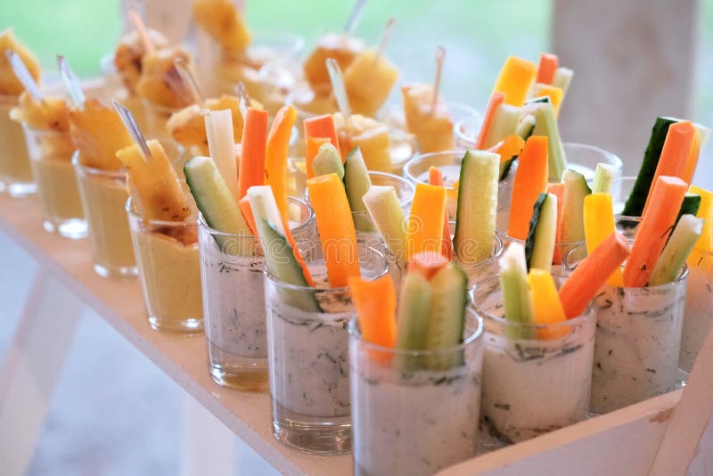 Vegetable Snacks in Glasses on Banquet Table. Treats for Guests at