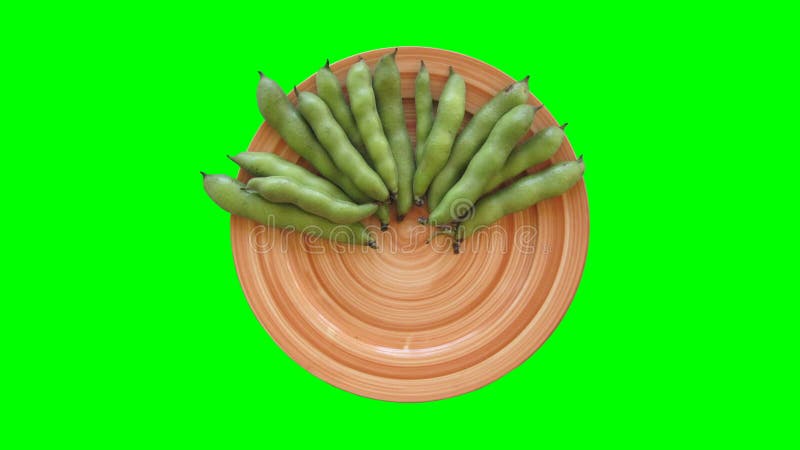 Vegetables appears on a Plate stop motion animation on green screen. Chroma key stock video