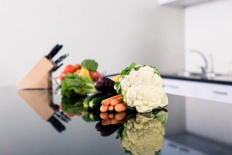 Vegetables on Kitchen Counter in Stylish Apartment Stock Photo Image