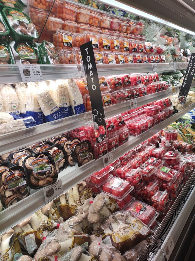 Vegetables Packed Inside Plastic Container and Plastic Wrap. Editorial
