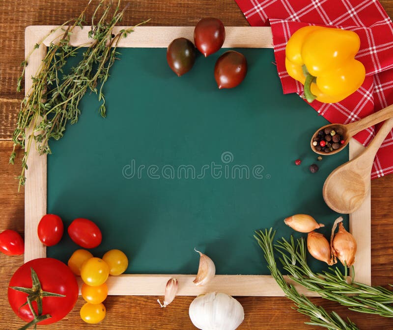 Vegetables still life with green board