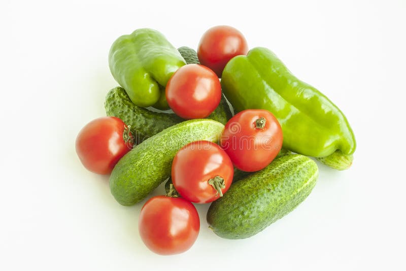 Vegetables Tomatoes, Cucumbers and Pepper Green on a White Background