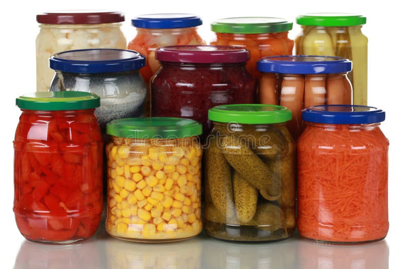 Canned vegetables such as corn, pickles and paprika in glass jars. Canned vegetables such as corn, pickles and paprika in glass jars