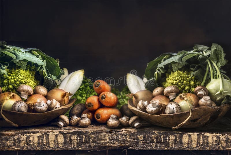 Fresh organic vegetables from garden on old rustic wooden table, vegetarian cooking concept. Fresh organic vegetables from garden on old rustic wooden table, vegetarian cooking concept