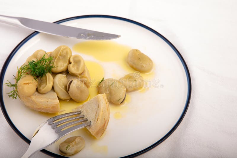 Vegetarian cuisine presentation of artichoke with broad bean