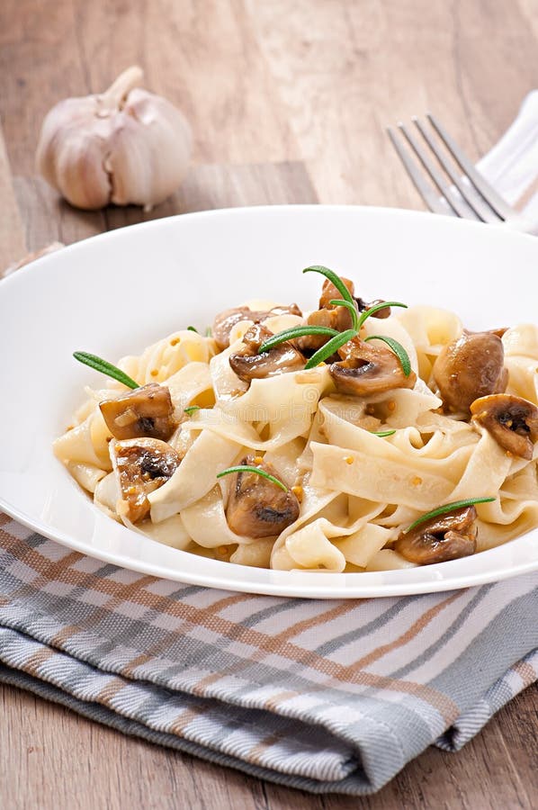 Vegetarian dish with tagliatelle and mushrooms royalty free stock images Vegetarian dish with tagliatelle and mushrooms royalty free stock images
