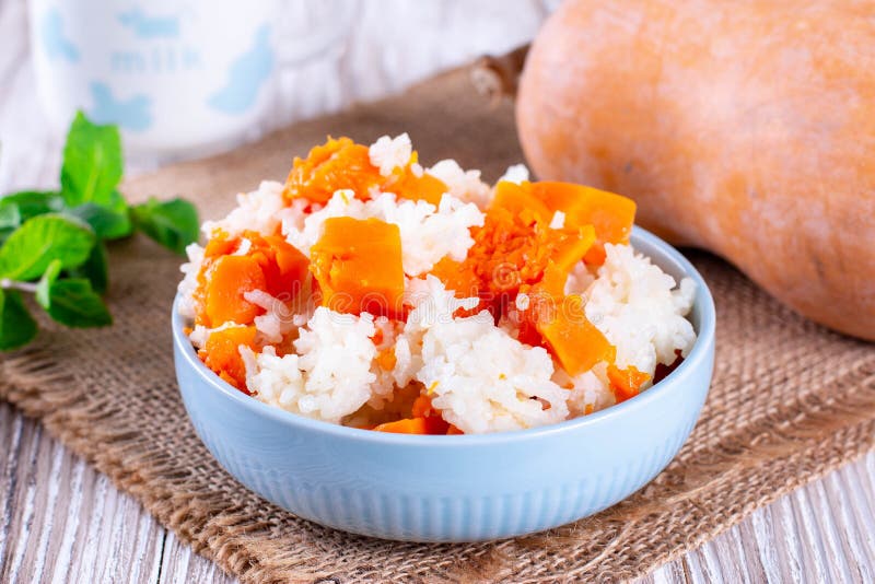 Vegetarian food: rice with pumpkin in a bowl on the table. Horizontal stock image Vegetarian food: rice with pumpkin in a bowl on the table. Horizontal stock image