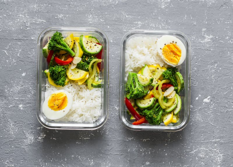 Meal prep containers with rice with chicken, baked vegetables, eggs,  sausages and salad for breakfast and lunch overhead shot, copy space, wtite  woode Stock Photo - Alamy