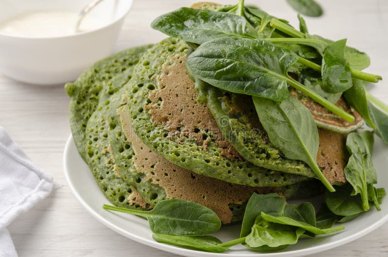 Vegetarian Pancakes, Served with Yogurt and Spinach Stock Photo Image