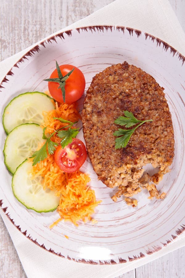 Vegetarian Steak Made from Vegan Meat Seitan, with Cherry Tomatoes