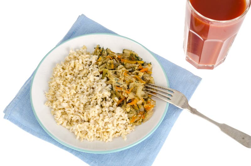 Vegetarisch gezond voedsel Gesmoorde kool met wortelen, ongepelde rijst royalty-vrije stock fotografie Vegetarisch gezond voedsel Gesmoorde kool met wortelen, ongepelde rijst royalty-vrije stock fotografie