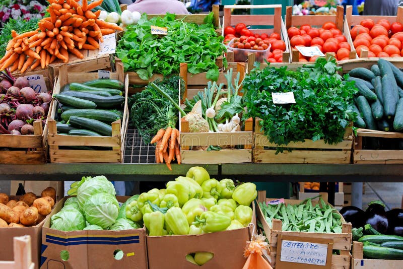 Family Buying Fresh Vegetables at Farmers Market Stall Stock Image