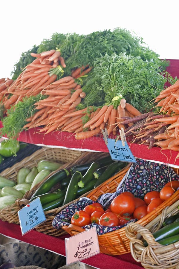 Carrots and an assortment of other fresh vegtables at a farmers market. Carrots and an assortment of other fresh vegtables at a farmers market.