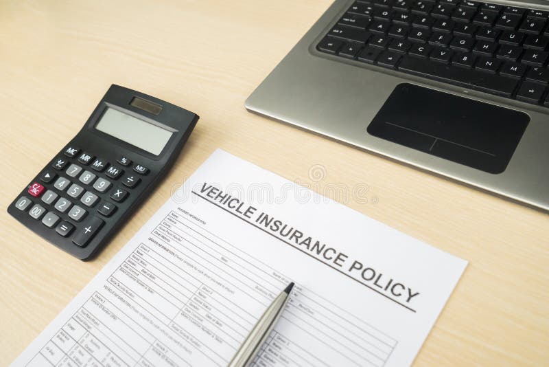 Vehicle Insurance Form with Calculator and Laptop Stock Image - Image