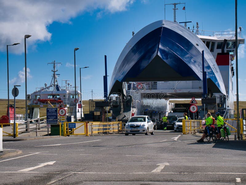 Vehicles leave the inter-island roro car ferry MV Daggri at the Ulsta ferry terminal on the island of Yell in Shetland, UK