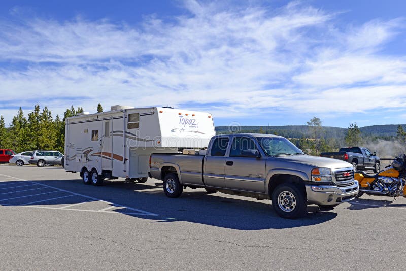 YELLOWSTONE NATIONAL PARK, WYOMING - CIRCA SEPTEMBER 2015. Recreational Vehicles or RVs are an increasingly popular way for tourists to visit National Parks such as Yellowstone. YELLOWSTONE NATIONAL PARK, WYOMING - CIRCA SEPTEMBER 2015. Recreational Vehicles or RVs are an increasingly popular way for tourists to visit National Parks such as Yellowstone.