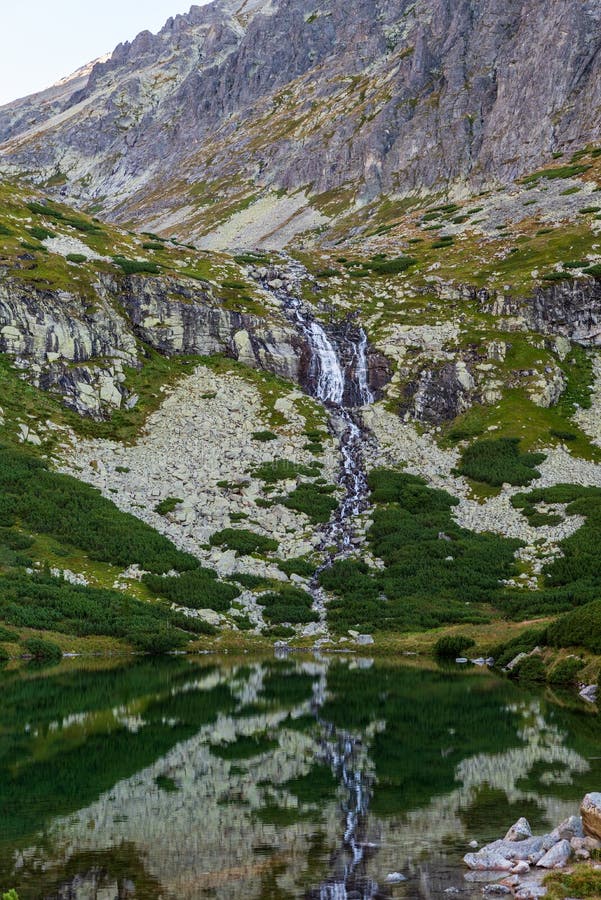 Velicky vodopad waterfall with Velicke pleso lake in Velicka dolina valley in Vysoke Tatry mountains in Slovakia
