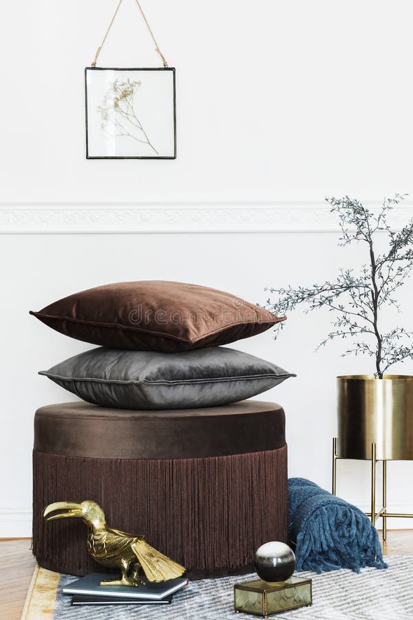 Velur pillows collection on the elegant pouf. stock photo