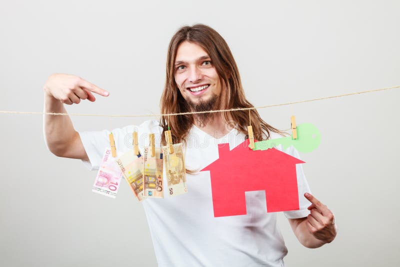Vendedor do homem com dinheiro e casa imagem de stock Vendedor do homem com dinheiro e casa imagem de stock
