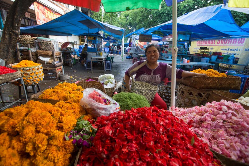 GIANYAR, INDONESIA - FEB 28, 2016: Unidentified local street vendor. Since the beginning of the XXI century the Bali's population increased by more than a million people, now more than 4,2 million. GIANYAR, INDONESIA - FEB 28, 2016: Unidentified local street vendor. Since the beginning of the XXI century the Bali's population increased by more than a million people, now more than 4,2 million.