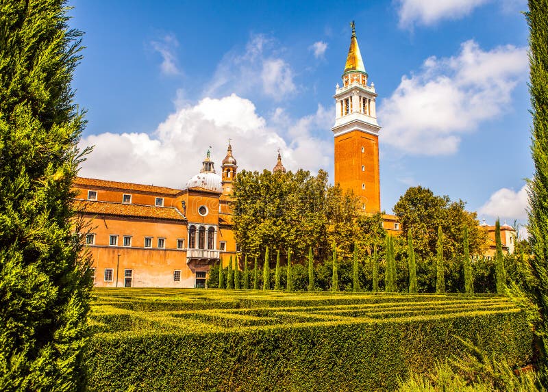 VENICE, ITALY - AUGUST 20, 2016: Famous architectural monuments and facades of old medieval buildings San Giorgio Maggiore island close-up on August 20, 2016 in Venice, Italy. VENICE, ITALY - AUGUST 20, 2016: Famous architectural monuments and facades of old medieval buildings San Giorgio Maggiore island close-up on August 20, 2016 in Venice, Italy.