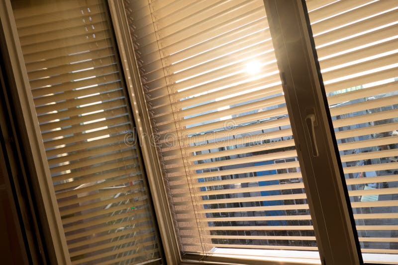 Venetian blinds for shade at the window