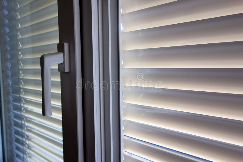 Venetian blinds for shade at the window