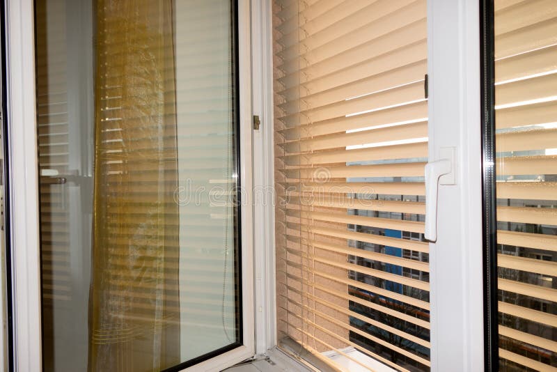 Venetian blinds for shade at the window