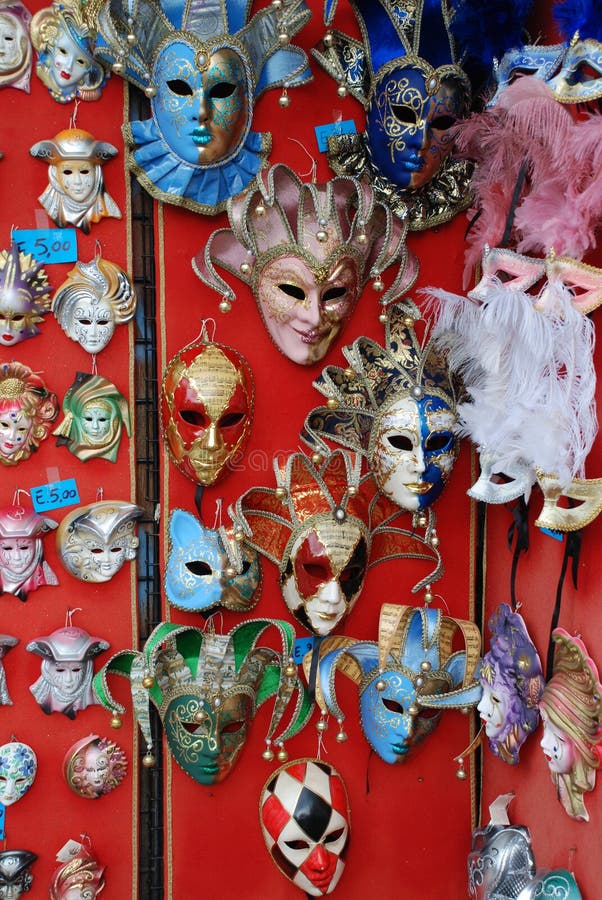 Colourful masks on a market stall ready for carnival goers to buy and wear. Colourful masks on a market stall ready for carnival goers to buy and wear