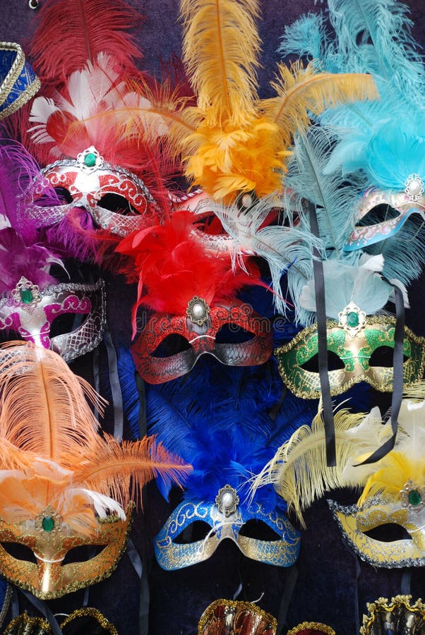 Colourful masks on a market stall ready for carnival goers to buy and wear. Colourful masks on a market stall ready for carnival goers to buy and wear