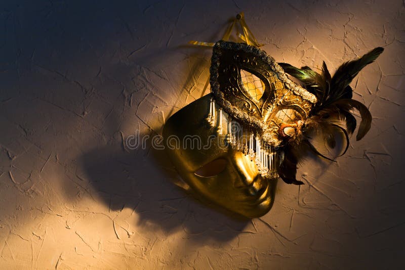 Venetian masks on old wall