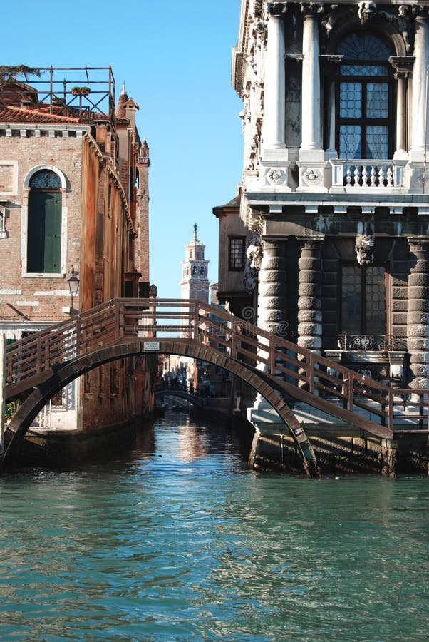 Canal with a bridge of wood in Venice, Italy