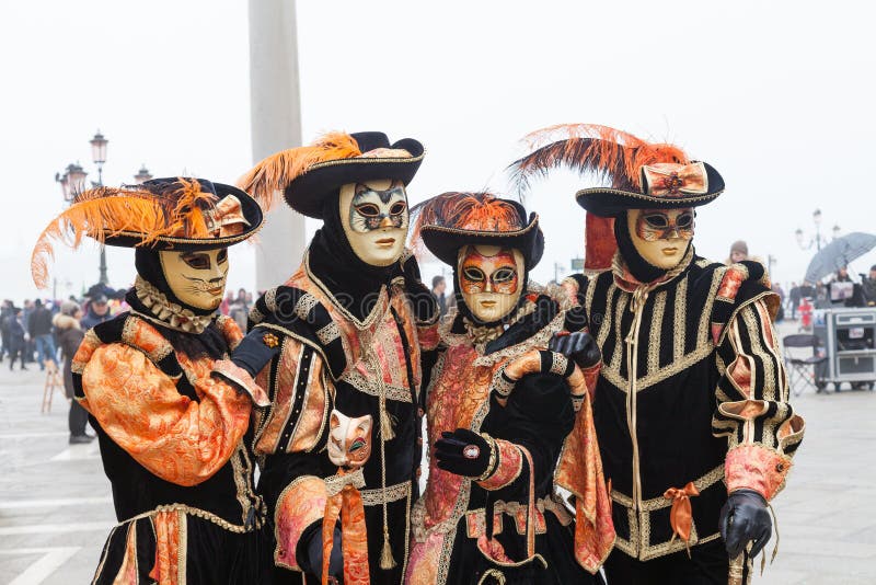 Venice Carnival, Italy. Four people in cat masks in Piazza San Marco stock photo Venice Carnival, Italy. Four people in cat masks in Piazza San Marco stock photo