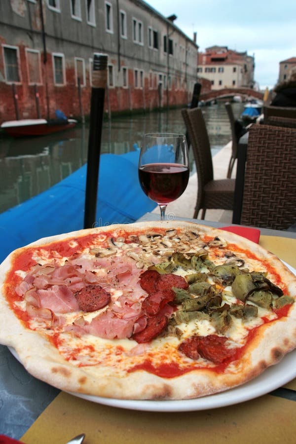 Venice: delicious pizza with a glass of wine stock photo