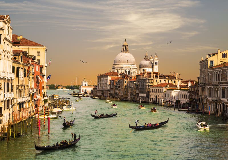 Venice, the Grand canal, the Cathedral of Santa Maria della Salute and gondolas with tourists, top view